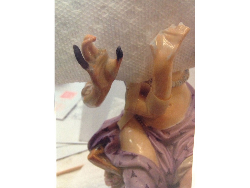 Broken figurine with fingers being reformed. (Virginia)