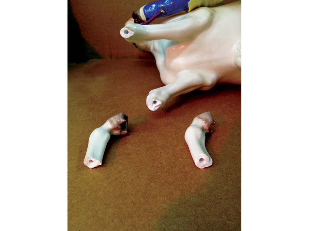 Broken legs of Meissen figurine. (Virginia)